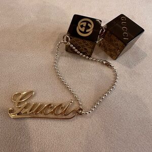 Gucci Black and Gold Logo Keychain/Bag Charm
